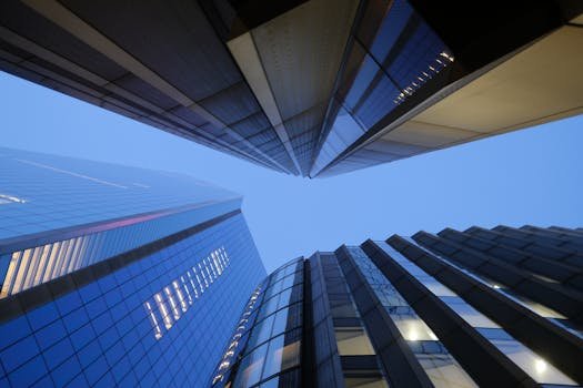 Upward view of sleek, modern skyscrapers in London's architectural landscape.