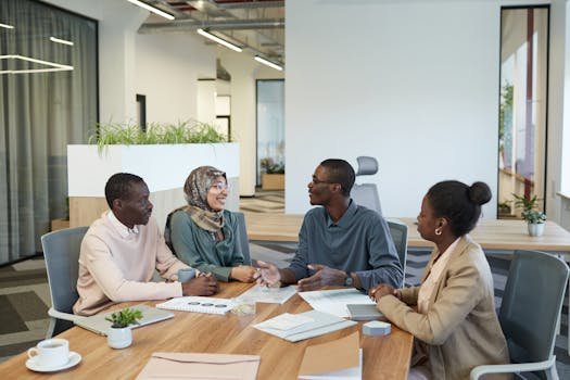 A group of professionals collaborating in a modern conference room, engaging in a lively discussion.