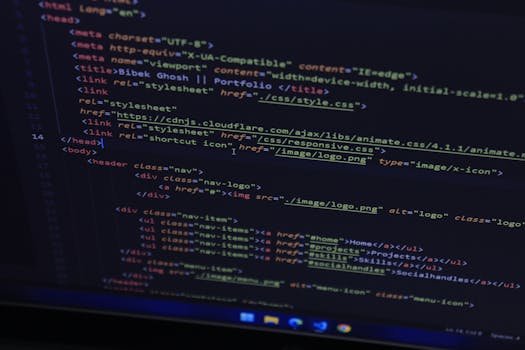 High-resolution close-up of HTML code displayed on a computer screen, perfect for technology themes.