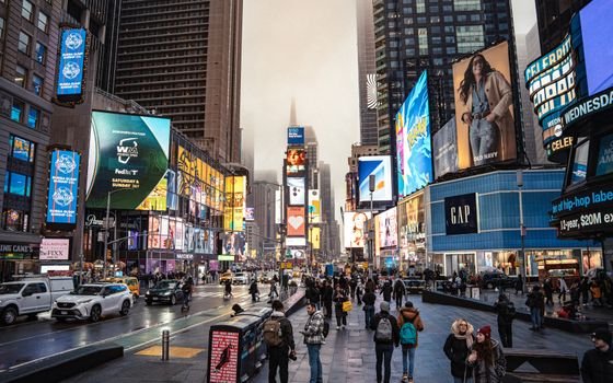 Bustling Times Square in New York City, featuring vivid billboards and lively urban life.